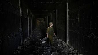 An Israeli soldier walks in a tunnel which the military says Hamas militants used in the southern Gaza Strip, about a 100 meters from the Philadelphi corridor along the border with Egypt, on Friday, Sept. 13, 2024. Image- AP