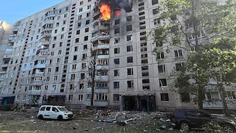 Flames rise and debris is scattered on the ground after a Russian aerial bomb struck a multi-story residential building in Kharkiv, Ukraine. AP