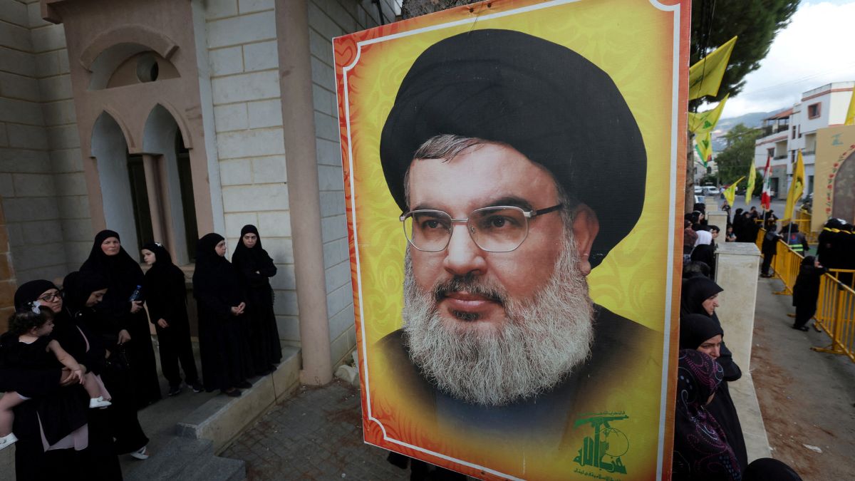 People stand near a picture of Hezbollah leader Sayyed Hassan Nasrallah during the funeral of Hezbollah member Ali Mohamed Chalbi, in Kfar Melki, Lebanon, September 19, 2024. File Image/Reuters People stand near a picture of Hezbollah leader Sayyed Hassan Nasrallah during the funeral of Hezbollah member Ali Mohamed Chalbi, in Kfar Melki, Lebanon, September 19, 2024. File Image/Reuters