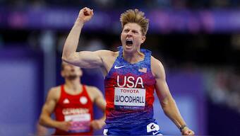 USA's Hunter Woodhall celebrates after winning the men's 400m T62 final. Reuters