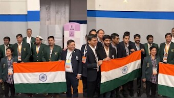 Pakistan team holds the Indian flag as a gesture to celebrate D Gukesh and Co's victories at the Chess Olympiad. Image: ChessBase India