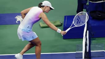 Iga Swiatek smacks her racket on the net during the match against Jessica Pegula at the US Open. AP