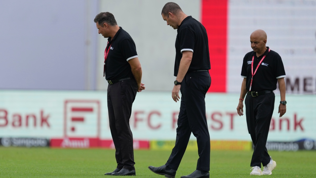 Match officials inspect the playing area on the third day of the second Test between India and Bangladesh in Kanpur. AP Match officials inspect the playing area on the third day of the second Test between India and Bangladesh in Kanpur. AP