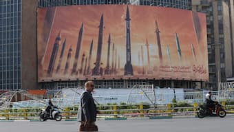 An anti-Israel billboard with a picture of Iranian missiles is seen in a street in Tehran, Iran, April 15, 2024. WANA via Reuters