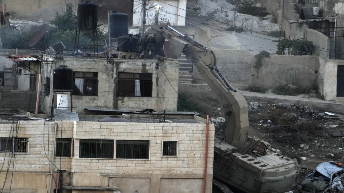 Israeli soldiers look over a rooftop where two bodies lie motionless in the West Bank town of Qabatiya during a raid, Thursday, Sept. 19, 2024. AP Israeli soldiers look over a rooftop where two bodies lie motionless in the West Bank town of Qabatiya during a raid, Thursday, Sept. 19, 2024. AP