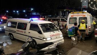 Ambulances arrive to evacuate the wounded near the site of an Israeli airstrike in Beirut's southern suburb, on Monday. AP 