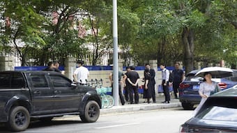 Chinese authorities inspect the scene of a stabbing at the Shenzhen Japanese School in Shenzhen, China on Wednesday, after a 10-year-old Japanese student was attacked by a man. AP