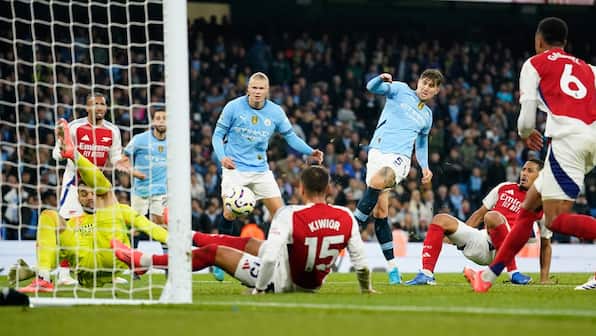 Premier League: Stones' stoppage-time equaliser helps City hold Arsenal to draw, maintain unbeaten home run