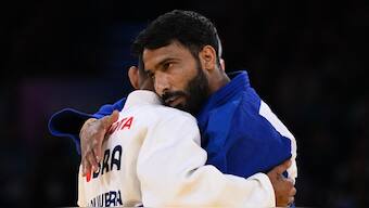 India's Kapil Parmar embraces his opponent, Brazil's Brazil's Elielton de Oliveira, at the end of his judo men's 60kg J1 bronze medal match. Reuters