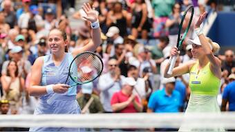 Jelena Ostapenko (L) and Lyudmyla KIchenok (R) wave to the crowd after defeating Kristina Mladenovic and Zhang Shuai to win the women's doubles title at the US Open. AP
