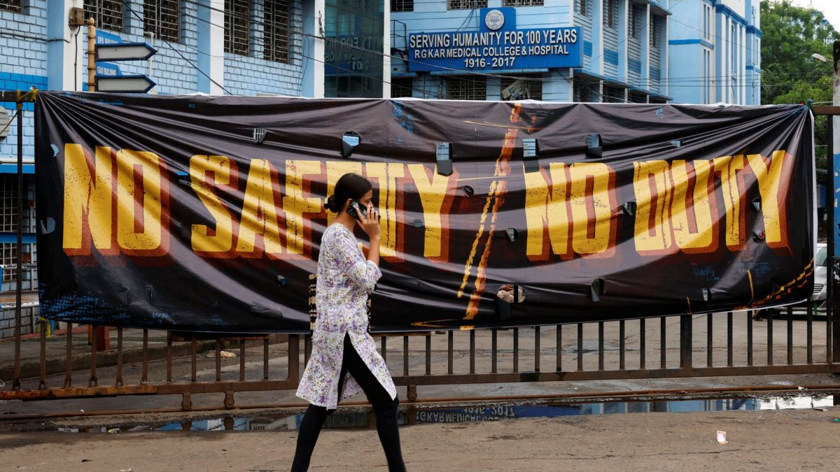 A woman walks past a closed gate of RG Kar Medical College and Hospital in Kolkata. Source: REUTERS. A woman walks past a closed gate of RG Kar Medical College and Hospital in Kolkata. Source: REUTERS.