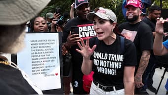 Laura Loomer, far-right activist, speaks with anti-Trump demonstrators near the entrance of the Fulton County Jail in Atlanta, Georgia, US, August 24, 2023. File Image/Reuters