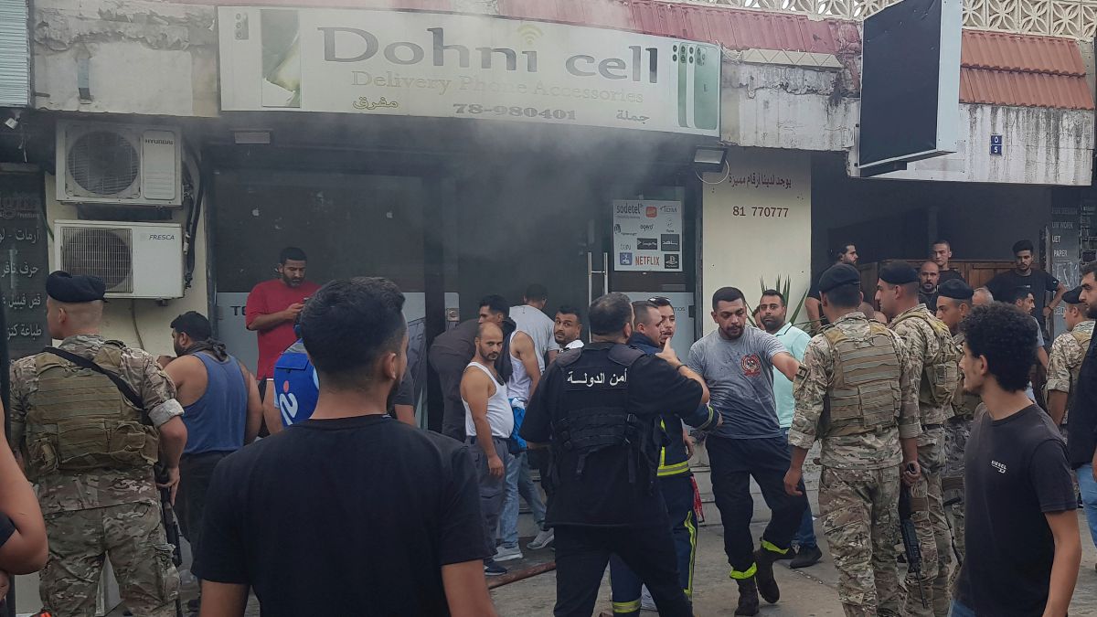 Lebanese soldiers and firefighters gather outside a mobile shop after what is believed to be the result of a walkie-talkie exploding inside it, in the southern port city of Sidon, Lebanon, September 18, 2024. File Image/AP Lebanese soldiers and firefighters gather outside a mobile shop after what is believed to be the result of a walkie-talkie exploding inside it, in the southern port city of Sidon, Lebanon, September 18, 2024. File Image/AP
