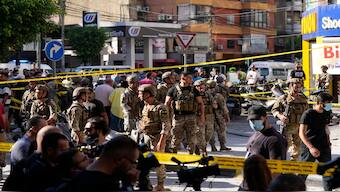 Lebanese soldiers cordon off the area at the site of an Israeli airstrike in Beirut's southern suburbs, on Thursday. AP 