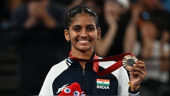 Indian para-shuttler Manisha Ramadass poses with the bronze medal that she won at the Paris Paralympic Games on Monday after defeating Denmark's Cathrine Rosengren. Reuters