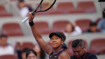Naomi Osaka celebrates after winning a match against Lucia Bronzetti during the China Open tennis tournament in Beijing. AP
