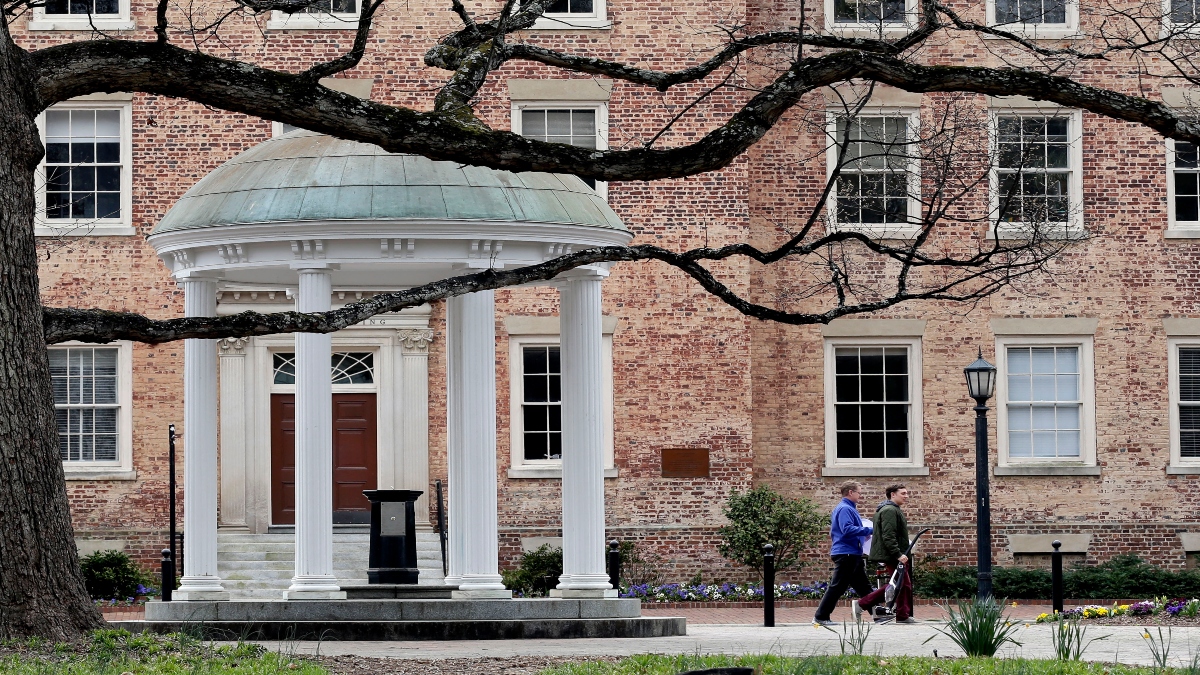 People remove belongings on campus at the University of North Carolina in Chapel Hill, N.C., on March 18, 2020. AP File People remove belongings on campus at the University of North Carolina in Chapel Hill, N.C., on March 18, 2020. AP File