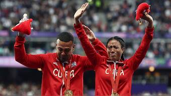 Visually impaired Cuban para-sprinter Omara Durand celebrates with her guide Yuniol Kindelan Vargas after winning gold in women's 200m in the T12 category in what would be the final race of her career. Reuters