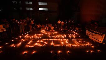 Doctors and health workers light candles depicting "We Want Justice" at the RG Kar Medical College and Hospital against the alleged rape and murder of a trainee woman doctor inside the hospital premises, in Kolkata,  Wednesday, September 4, 2024. PTI 