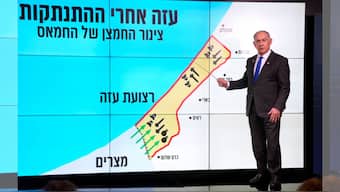 Israeli Prime Minister Benjamin Netanyahu stands before a map of the Gaza Strip, telling viewers how Hamas has imported arms into the territory since Israel's withdrawal in 2005, during a news conference in Jerusalem, September 2, 2024. The Hebrew on the screen reads, "Gaza after the disengagement, oxygen pipe of Hamas". File Image/AP