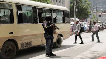 A police officer stands guard in the street, in Port-au-Prince, Haiti May 1, 2024. Reuters