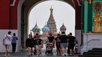People walk near the Red Square with St. Basil's Cathedral seen in the background in Moscow, Russia. File image/ Reuters