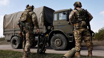 Three Indians, who were duped and forced to work in the Russian army, returned India said they returned with the help of the Ministry of External Affairs. Source: Reuters.