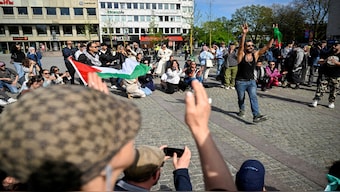 Counter-demonstrators and police officers gather at Gustav Adolfs Torg on the occasion of a public gathering where the organiser intends to burn a Quran, in Malmo, Sweden, May 3, 2024. Reuters File
