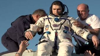 Crew member of the International Space Station (ISS), Roscosmos cosmonaut Nikolai Chub is assisted while leaving the Soyuz MS-25 space capsule after landing in a remote area near Zhezkazgan, Kazakhstan on on Monday, in this still image taken from video. Reuters