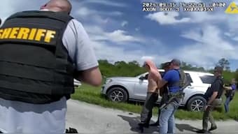 In this image taken from police body camera video and released by the Martin County, Fla., Sheriff’s Office, law enforcement officers arrest Ryan Routh, the man suspected in the apparent assassination attempt of Donald Trump. AP