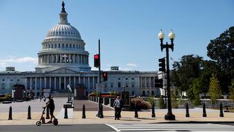 A man passes by the US Capitol on his scooter in Washington, DC, US, September 10, 2024. Image courtesy: Reuters 