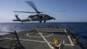 An HSC-7 helicopter lands on the Arleigh Burke-class guided missile destroyer USS Laboon in the Red Sea, June 12, 2024. AP