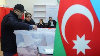 A voter casts a ballot at a polling station during presidential elections in Baku, Azerbaijan, February 7, 2024. REUTERS