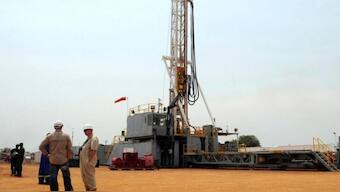  Workers are seen at an oil exploration site in Bulisa district approximately 244km (152 miles) North-West of Kampala January 20, 2012. REUTERS