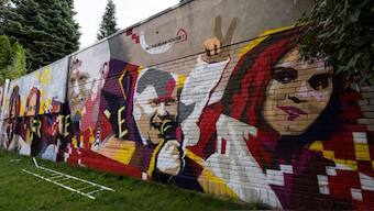 Faces of Belarusian political prisoners are painted on a graffiti in Warsaw, Poland, July 25, 2023. REUTERS