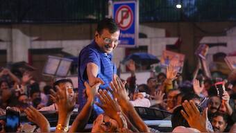 Delhi Chief Minister Arvind Kejriwal acknowledges supporters amid rainfall after walking out of the Tihar Jail, in New Delhi, September 13, 2024. PTI