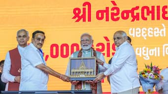 Prime Minister Narendra Modi being presente a memento by Gujarat CM Bhupendra Patel and Union Minister CR Patil during a public meeting, in Ahmedabad, Gujarat, September 16, 2024. PTI