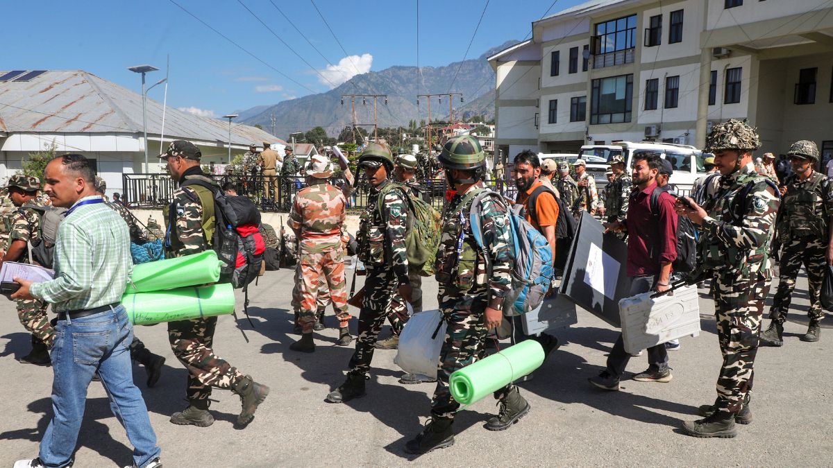 Polling officials with security personnel leave for their respective polling stations on the eve of first phase of the Jammu and Kashmir Assembly election, in Kishtwar district, September 17, 2024. PTI Polling officials with security personnel leave for their respective polling stations on the eve of first phase of the Jammu and Kashmir Assembly election, in Kishtwar district, September 17, 2024. PTI