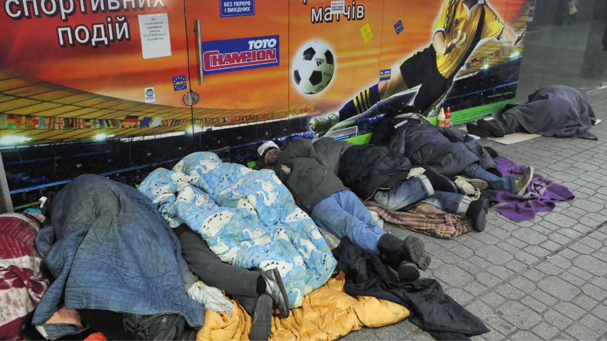 Homeless people sleep at a metro entrance in Kyiv. AFP file Homeless people sleep at a metro entrance in Kyiv. AFP file