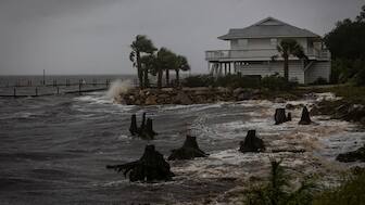 Waves impact a house seawall as Hurricane Helene intensifies before its expected landfall on Florida’s Big Bend, in Eastpoint, Florida, U.S. September 26, 2024. REUTERS