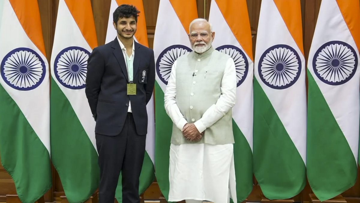 Prime Minister Narendra Modi with chess Grand Master Vidit Gujrathi during an interaction with 45th FIDE Chess Olympiad winning Indian teams, at his residence, in New Delhi. PTI Prime Minister Narendra Modi with chess Grand Master Vidit Gujrathi during an interaction with 45th FIDE Chess Olympiad winning Indian teams, at his residence, in New Delhi. PTI