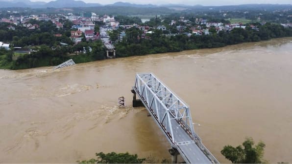 WATCH: Busy bridge in typhoon-hit Vietnam collapses, cars, bikes plunge into Red river