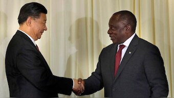 (File) South African President Cyril Ramaphosa, right, shakes hand with Chinese President Xi Jinping. AP