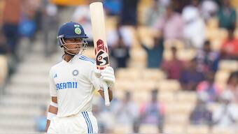 India opener Yashasvi Jaiswal raises his bat in celebration after completing his half-century on Day 1 of the first Test against Bangladesh in Chennai. AP