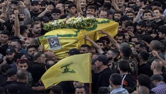 Mourners carry the coffin of Mohammed Mahdi, son of Hezbollah legislator Ali Ammar, who was killed Tuesday after his handheld pager exploded, in the southern suburb of Beirut, Lebanon. AP