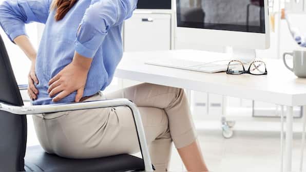 What is 'dead butt syndrome' caused by sitting for too long?