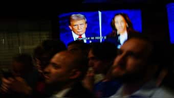 People watch the presidential debate between Republican presidential nominee and former US President Donald Trump and Democratic presidential nominee and US Vice President Kamala Harris at a watch party hosted by the New York Young Republican Club, in New York City, US. Reuters
