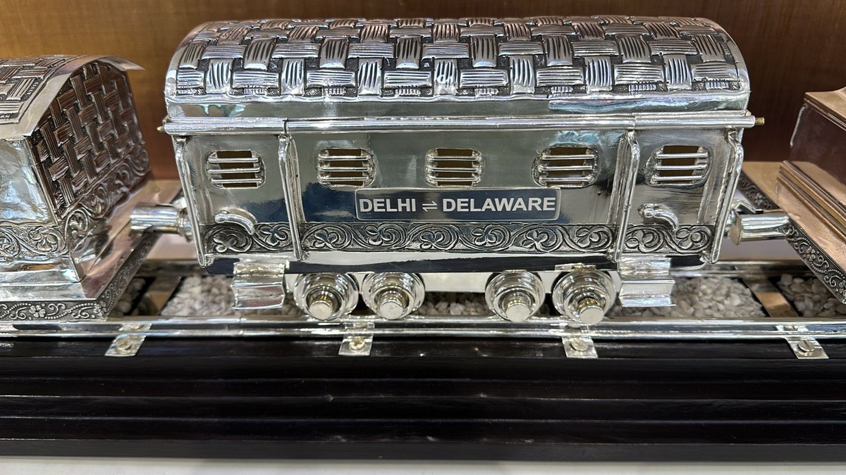 Prime Minister Narendra Modi gifted US President Joe Biden an antique silver hand-engraved train model. News18 Prime Minister Narendra Modi gifted US President Joe Biden an antique silver hand-engraved train model. News18