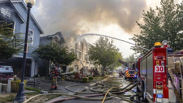 WATCH: 3 dead after small plane crashes into a row of townhouses in ...