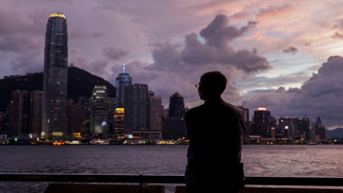 A man stands in front of Victoria Harbour, with the Central financial district in the background, as typhoon Yagi approaches in Hong Kong, China September 5, 2024. Reuters A man stands in front of Victoria Harbour, with the Central financial district in the background, as typhoon Yagi approaches in Hong Kong, China September 5, 2024. Reuters